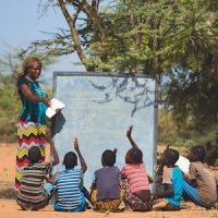 Teacher Ewesit Centrine teaches children under trees at a mobile school some 50 kilometres from Lodwar , Turkana, Kenya, 24 June 2013.  Picture/Karel Prinsloo/ ARETE