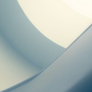 Organic smooth curves and minimalist shapes form an abstract design with subtle gradients of light and shadow, evoking calm and contemplation.